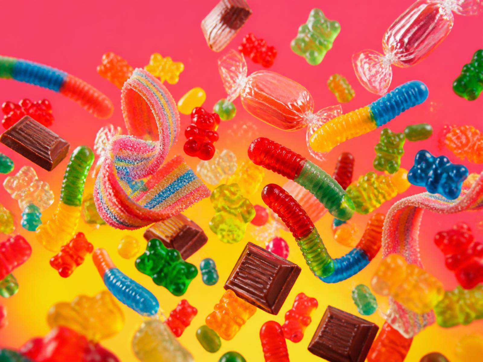 A colorful explosion of gummy bears, sour belts, wrapped candy and chocolate